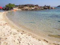 Fine sand and shallow crystal waters on the beach Lagonissi in Vourvourou, Chalkidiki